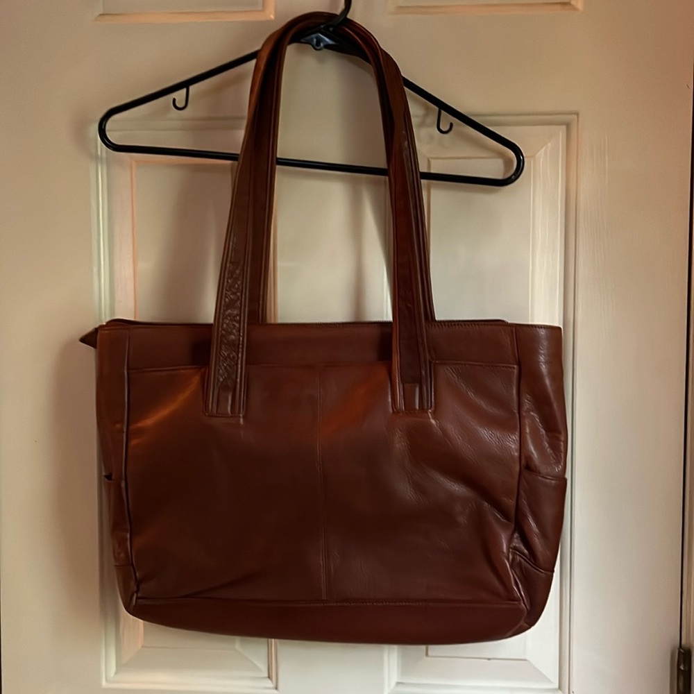 Osgood Marley leather bag. With zippered pocket inside. Pockets outside as well.